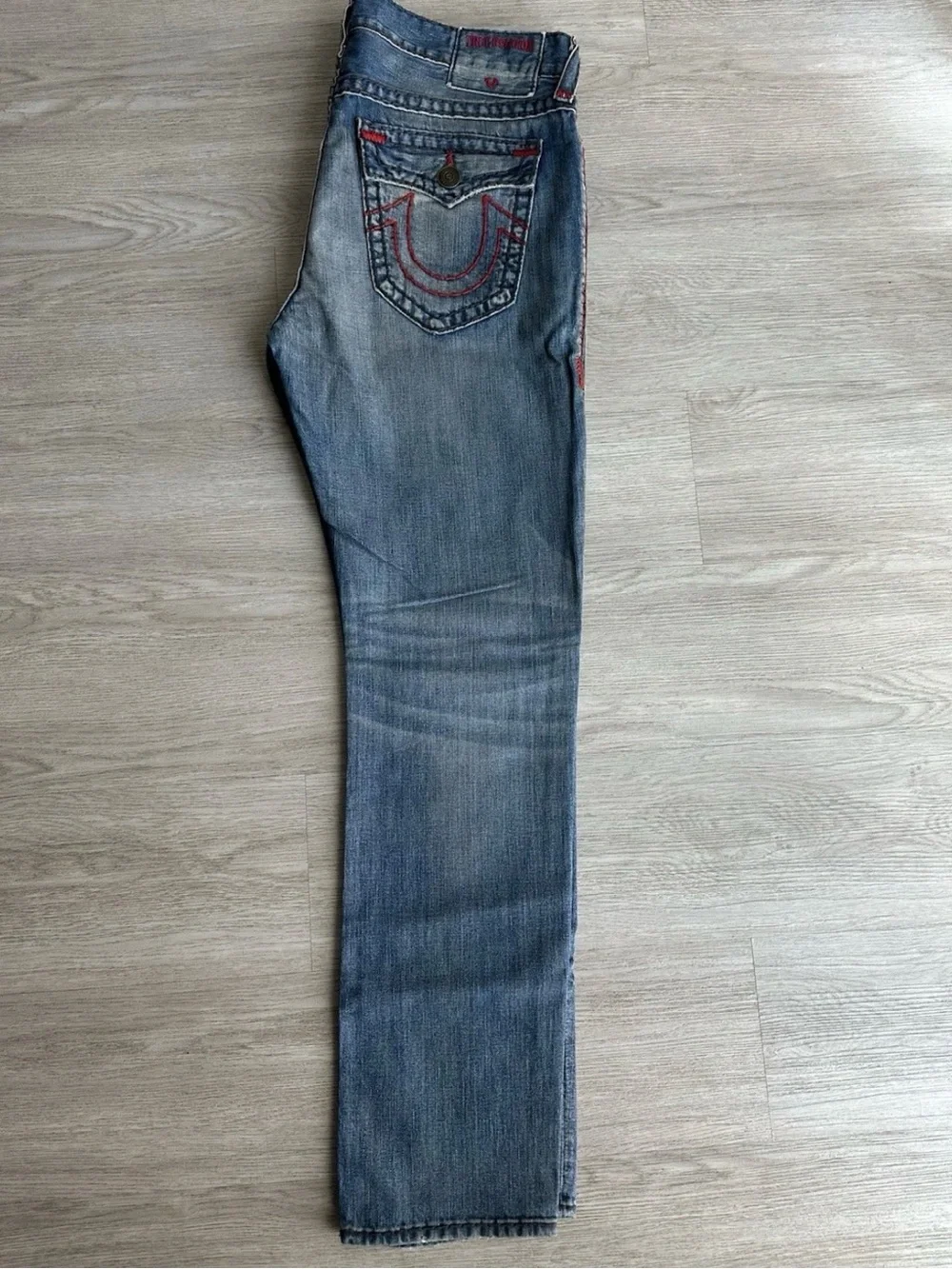 True Religion Faded Blue Slim Straight Jeans with Subtle Whiskering